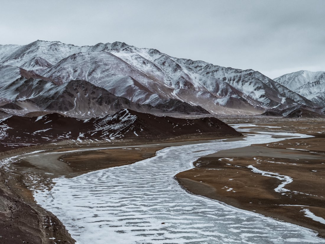 Snow-covered mountain range in Ladakh at high altitude